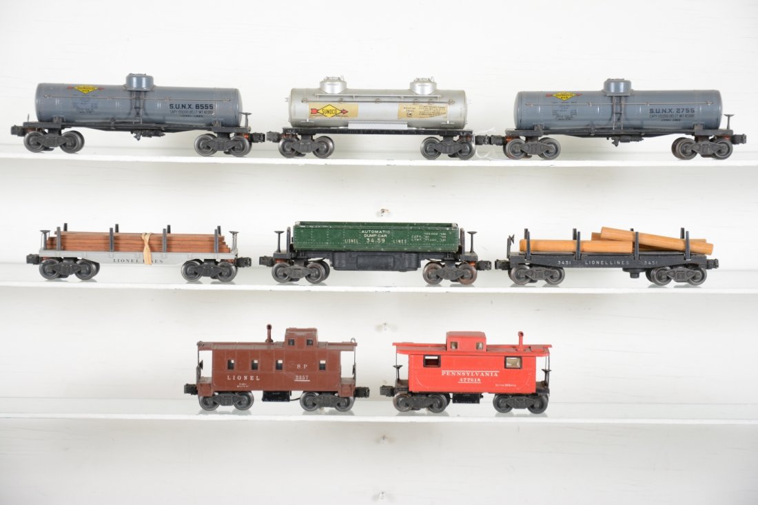 Lionel Rolling Stock: Includes a restored 2755 & 6555 Sunoco tank cars; 3459 coal dump; 3451 log dump car; 2411 flat with replaced load; 2357 caboose; 2457 caboose, missing 3 window inserts. Rest show moderate playwear, C6