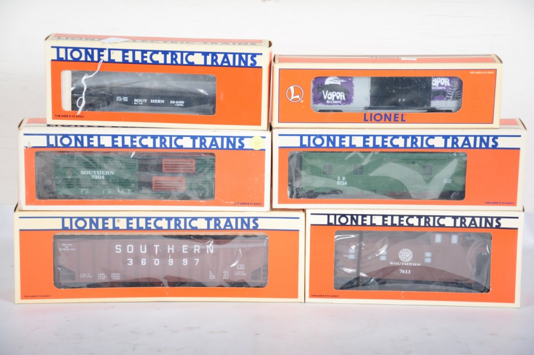 Lionel Southern Freight Cars, Plus: Includes a 19406 stake flat; 7304 D-door boxcar; 52127 hopper; 5786 Bunk car; 17613 smoke caboose; plus a 29218 Vapor boxcar. All are new in boxes, C10