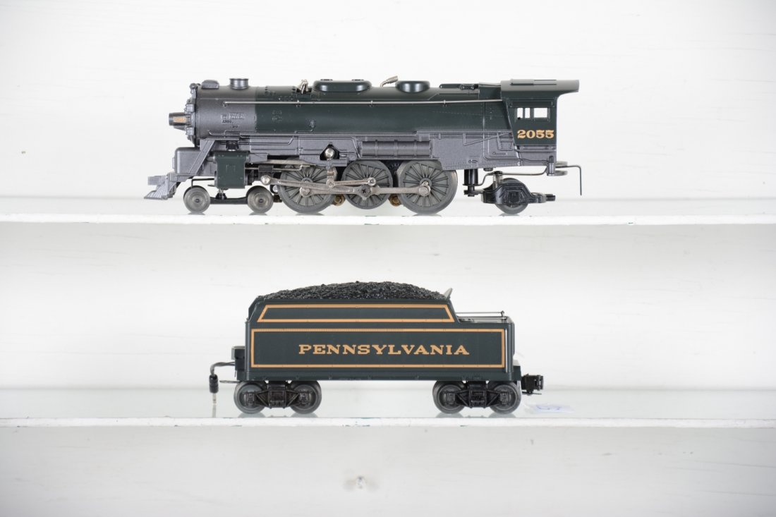 Lionel 18050 #2055 PRR Loco with Case: Nice reissue with light, smoke & whistle tender with display case, top cracked in case. Loco shows light runtime with C9 bodies.