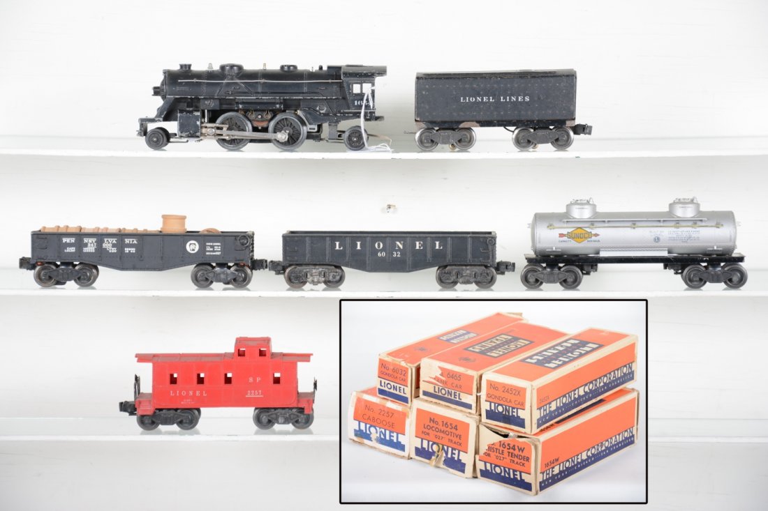 Boxed Lionel Steam Freight Set: Includes a 1654 cast loco; 1654W whistling tender; 6032 gondola; 6465 tank car; 2452 gondola; 2257 caboose, repaired roof. All have worn boxes with some inserts, C5-6