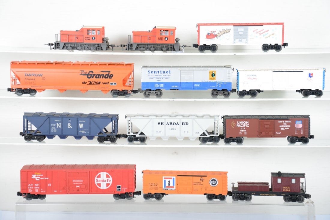 Modern Lot: Includes 2 Atlas 0-6-0 diesels; Lionel 19709 smoke caboose, missing stack top; 9801 boxcar; 9135 quadhopper; 9419 boxcar; 9444 boxcar; 19908 Christmas boxcar; 19309 quadhopper; 9769 boxcar; Weaver box