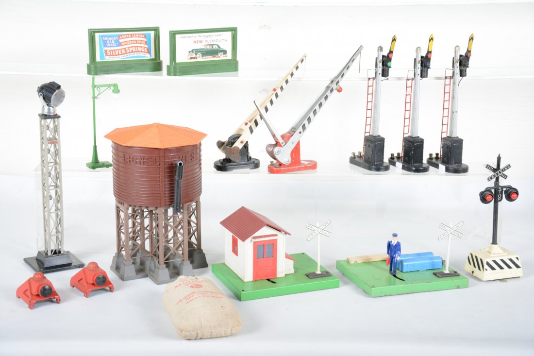 Lionel Accessories: Includes 299 light tower; 3 #151 semaphores; 1047 flagman; 2 #310 billboards; 152 crossing gate; 145 gateman; 79 flasher; 138 water tank, 1 cracked strut; 2 #260 cast bumpers; 64 lamppost, replaced bu