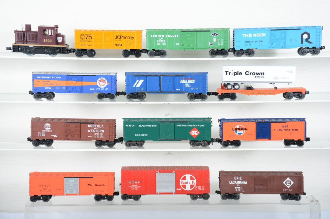 Modern Rolling Stock & Diesel Lot: Includes an 8900 PRR switcher; Lionel Boxcars- 9054, 16258, 9782, 9783, Rail Links; 9492, 9705, 9602, Atlas Erie boxcar; 9704; KMT REA reefer; 9282 trailer flat. All show light runtime, most nice C8+-