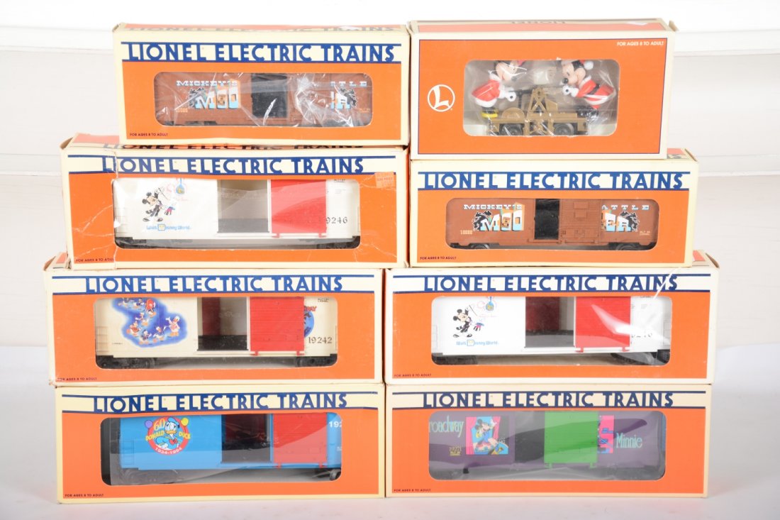 Lionel Disney Car Lot: Includes 18443 Mickey & Minnie hand car; Boxcars- 19246, 19270, 19271, 19246, 19242, 2 #16686 Mickey & Bad Pete animated boxcars. Some show light runtime, all with C9 bodies with boxes, some worn, C9-