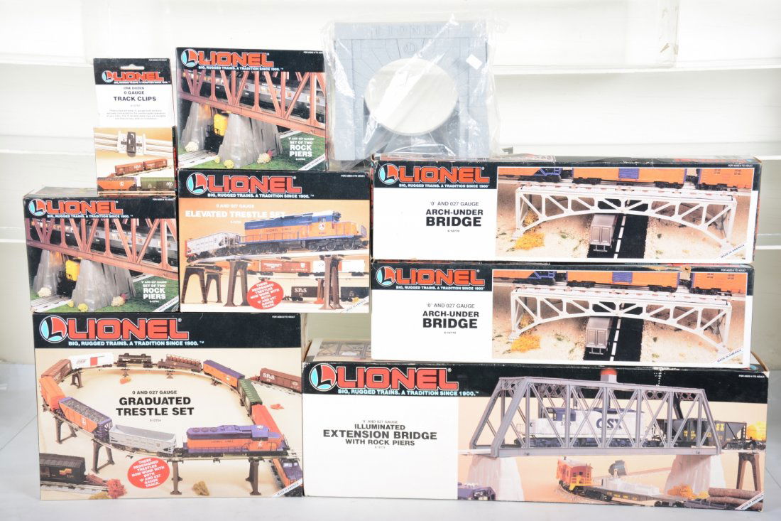 Lionel Bridge & Trestle Group: Includes 12772 extension bridge with rock piers; 2 #12744 Rock Piers; 2 #12770 arch-under bridges; 12754 trestle set; 12755 trestle set; 12896 tunnel portals, most appear new in boxes, C9-10
