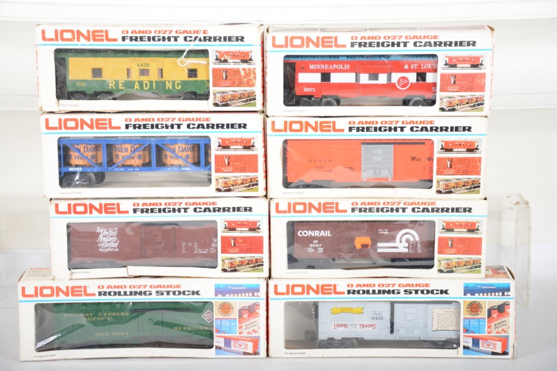Lionel Rolling Stock: Includes 9271 M&StL bay window caboose; 6439 Reading bay window caboose; 9863 REA reefer; 9431 Lionel Prewar boxcar; 9146 Mogen David vat car; 9705 DRGW boxcar; 9423 NYNH&H boxcar; 9037 Conrail boxcar
