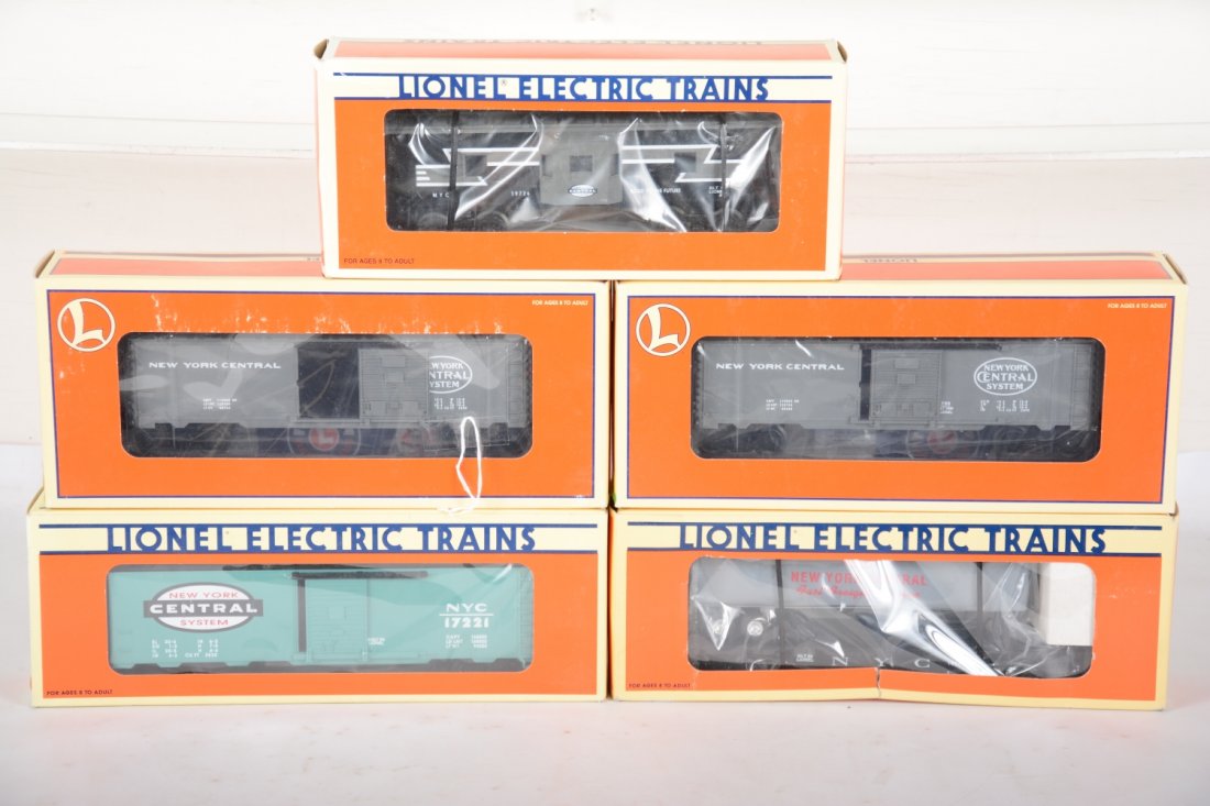 Lionel NYC Freight Cars: Includes 2 #28234 boxcars; 16925 flat with trailers; 176221 boxcar; 19726 bay window caboose. All appear like new with boxes, C9-10. (will look great behind the locos in lot 92)