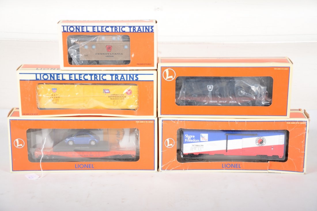 Lionel Freight Cars: Includes 19702 PRR caboose; 17304 Wabash reefer; 19483 flat with VW; 19259 Bicentennial NP reefer, ob worn; 19454 PRR flat with gondola. All appear unrun, rest with nice boxes, C9-10