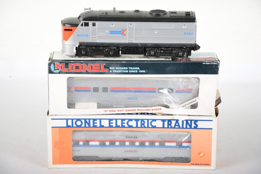 Lionel Amtrak Diesel Set: Includes an 8664 Alco A diesel; 16033 baggage; 15100 coach. All show light playwear with C9 bodies and car boxes only, worn, C8+-9