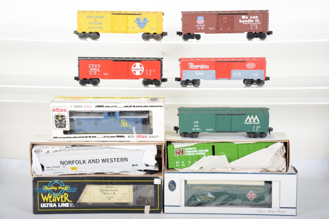 Modern Rolling Stock Lot: Includes Boxed Atlas C&O caboose; Boxed Weaver Hi Rail MT&W boxcar; N&W Cylinder hopper; Weaver 17500 Wilson Milk reefer; Crown Models REA reefer, all like new with boxes, C9; Loose rolling stock 9781