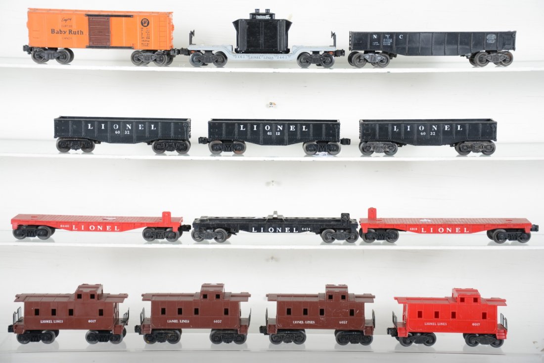 Clean Lionel Rolling Stock: Includes scarce 6454 BR boxcar, 2 drill holes in roof; 2 #6032 gondolas; 2 #6037 cabooses; 6112 gondola; 2 #6017 cabooses; 2461 flat with transformer, 1 intact insulator; 6462 gondola(dirty); 3 flat c