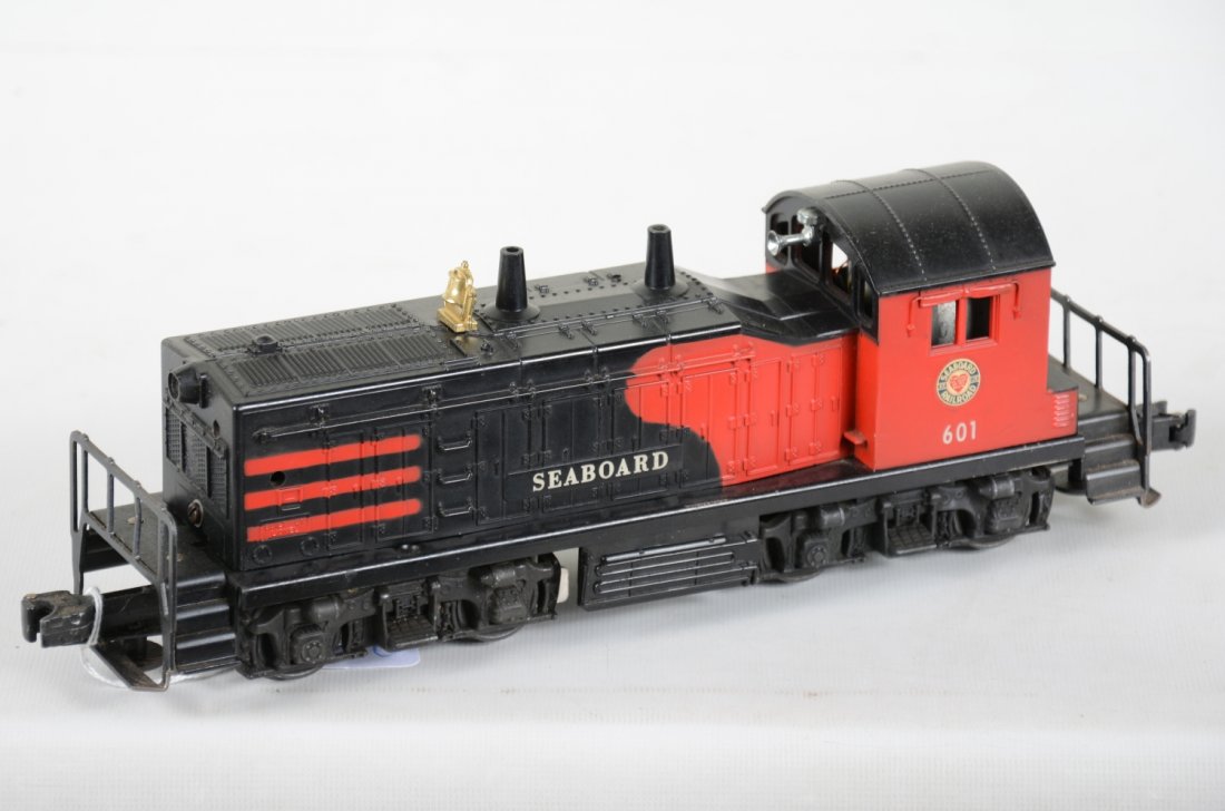 Lionel 601 Seaboard NW2 Diesel with Horn: Clean with C7+ appearance, but has been modified with access holes in hood and lower edge. Frame shows light playwear.
