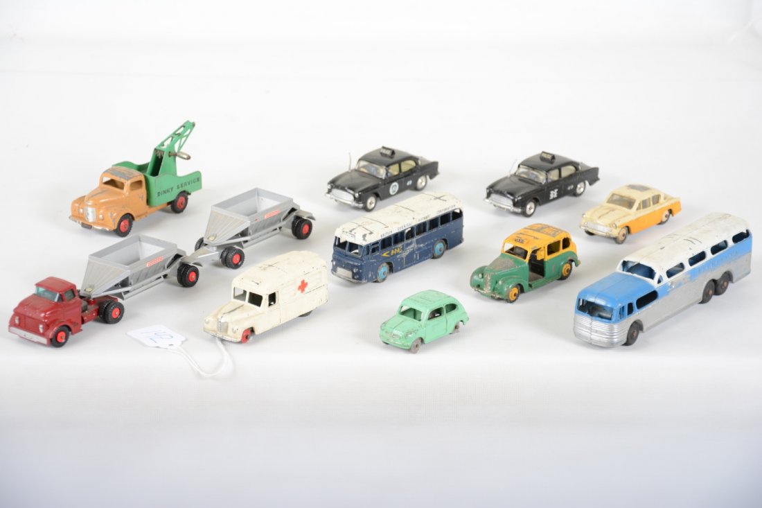 Vintage Diecast Vehicle Lot: Includes 8 Dinky Toy vehicles, a Matchbox King size hopper train & TootsieToy Grey Hound Scenic Cruiser bus. All show wear, C3-6, so examine photos closely.