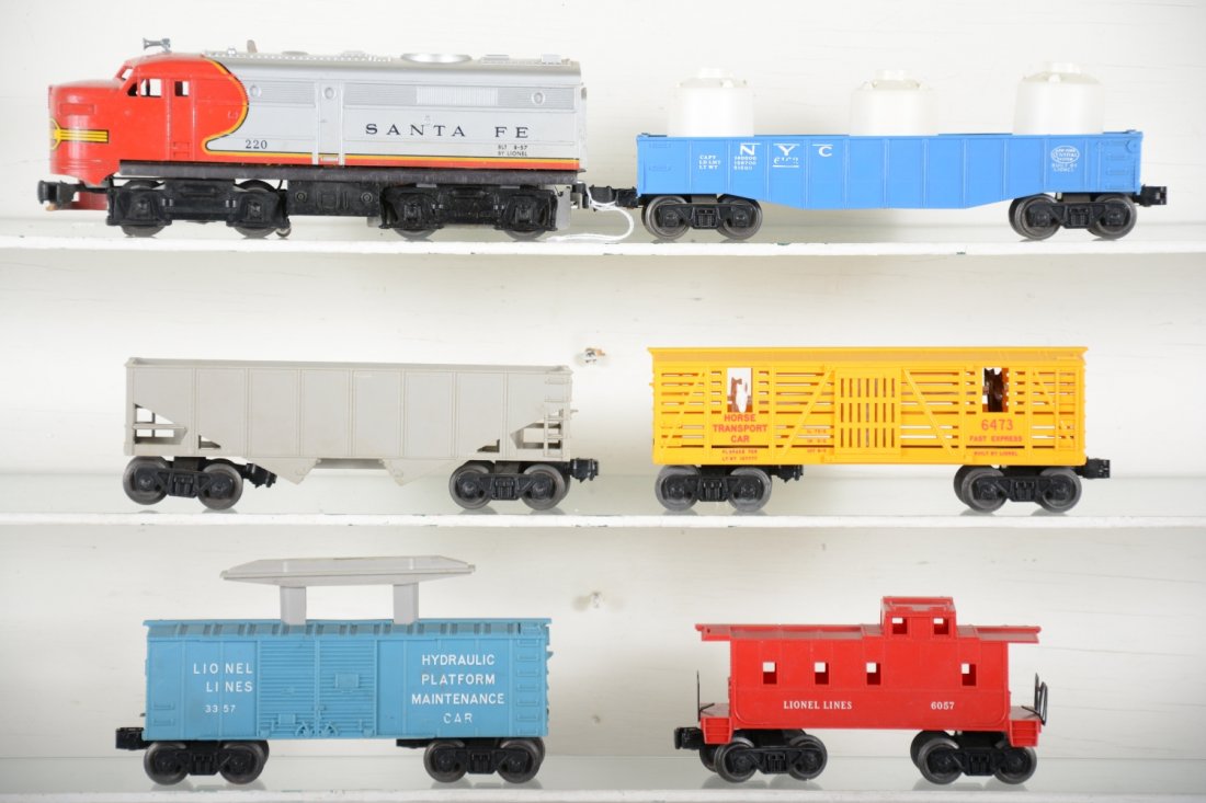 Lionel 220 Diesel Freight Set: Includes a 220 SF diesel, broken cowl; (6076) hopper; teal blue 3357 hydraulic maintenance, no accessories; 6473 horse car; 6162-110 gondola with canisters; 6057 caboose. Otherwise, all show light to 