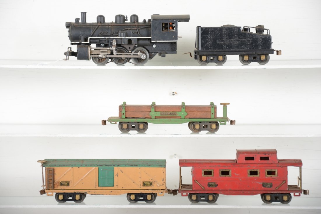 American Flyer Steam Freight Set: Includes a 429 O gauge switcher with tender, old restoration minus decals; 3208 boxcar; 3206 lumber car; 3211 caboose. Rest shoe moderate playwear and could benefit from a cleaning, C5