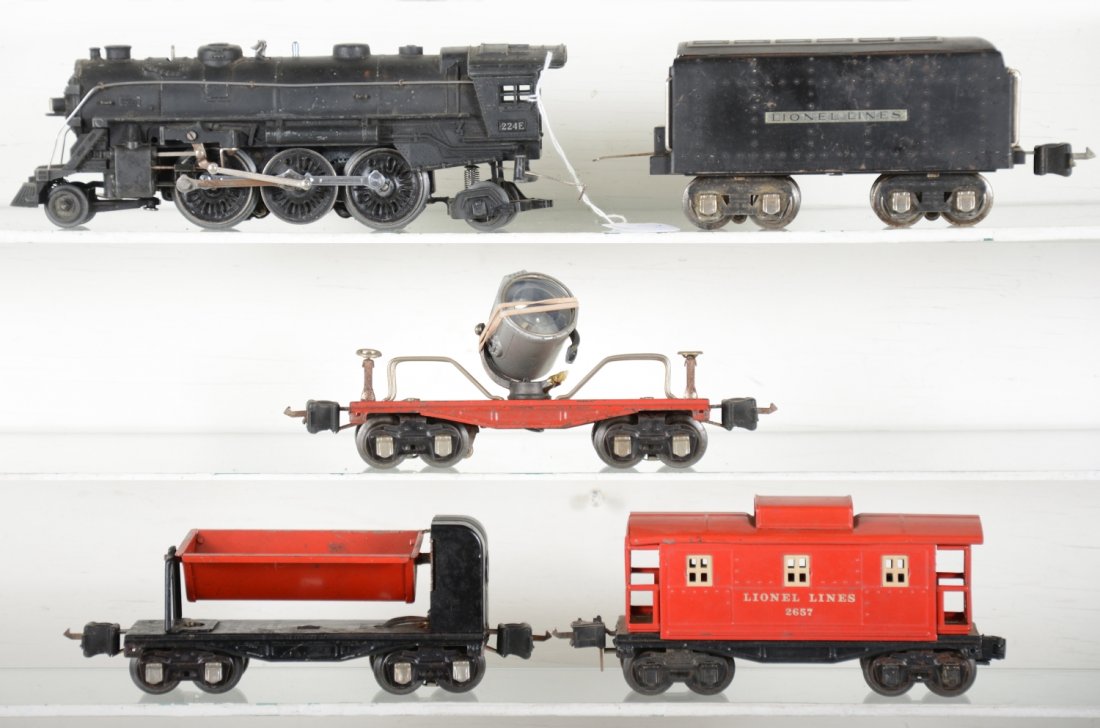 Lionel 224E Steam Freight Set: Includes a 224E loco, clean with 1 broken running light; 265W tender; 2620 searchlight, broken yoke; 3659 ore dump; 2657 caboose. All show moderate playwear, C6ish