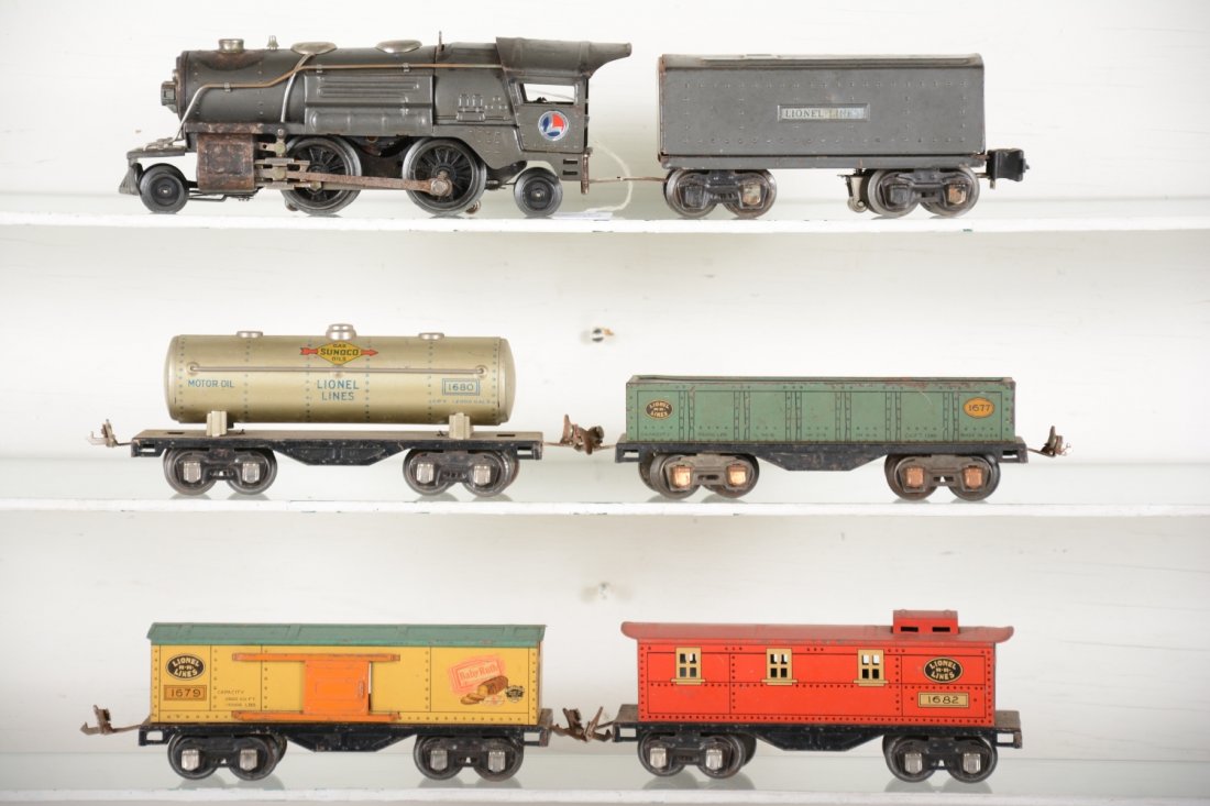 Lionel 259E Steam Freight Set: Includes a gunmetal 259E loco, some paint loss by stack & steam chests; 2689T tender; 1677 gondola; 16790 boxcar; 1680 tank car; 1682 caboose. Rest show moderate playwear, C6