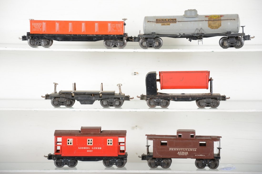 Lionel Pre War Rolling Stock: Includes 3651 lumber dump; 2812X gondola; 3659 ore dump; 2755 gray tank car, frame repaired; 2672 caboose; 2657 caboose. Grade range is C5-7, so examine photos closely.