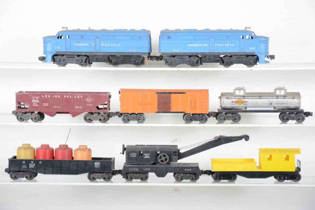 Lionel 205 Diesel Freight Set: Includes a 205 MP AA diesels, 1 shell cracked; 6460 crane; 6462 gondola; scarce 6454 SF boxcar, 1 catwalk chipped; 6465 tank; 6456 LV hopper; (6120) work caboose. All are very dirty, but only show mod