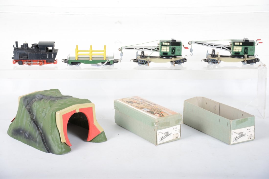 Biller Bahn Trains: Unusual German On3 trains includes a clockwork 0-4-0 steam loco; 2 unusual crane cars; stake flat with plastic tunnel. They include 1 1/2 boxes and show light playwear, C7-8