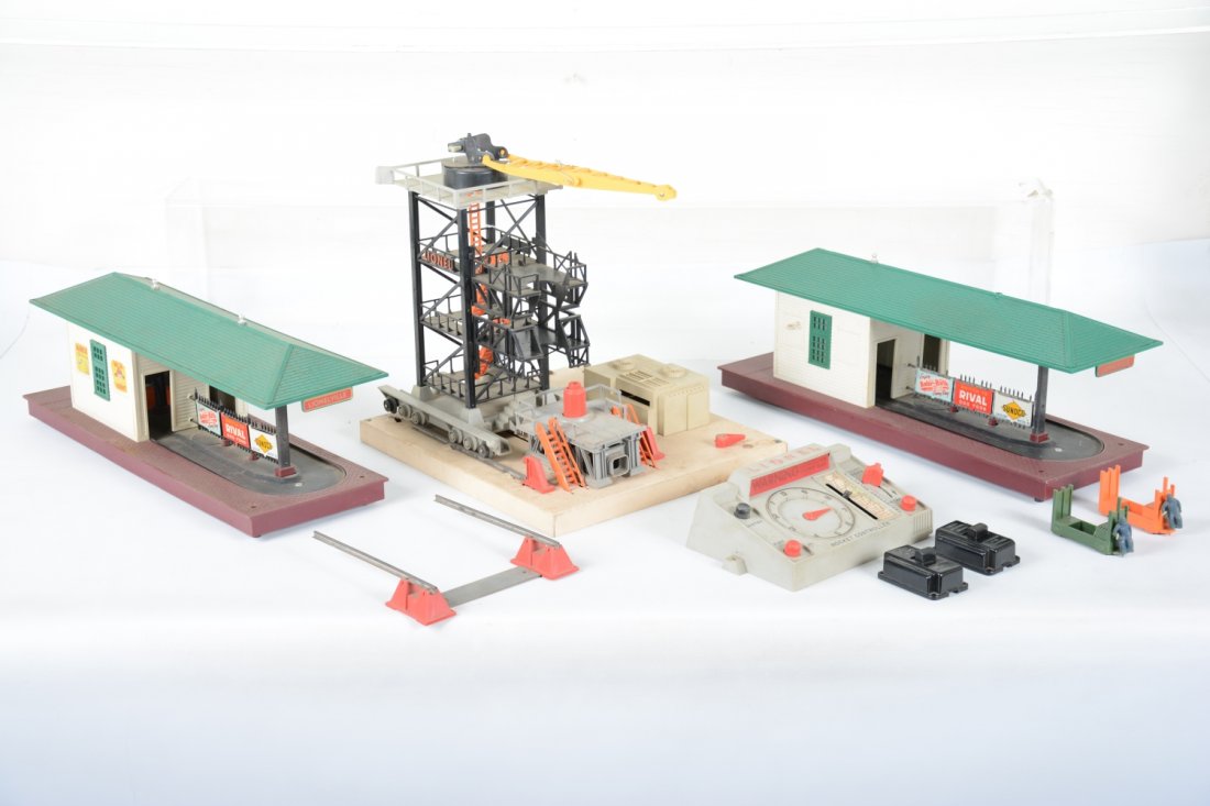 Lionel Accessories: Includes 2 #356 operating Freight stations with 1 pr carts and 2 controllers. 1 is missing a finial and dirty, C6; 175 rocket launcher with issues as photoed; great for parts.