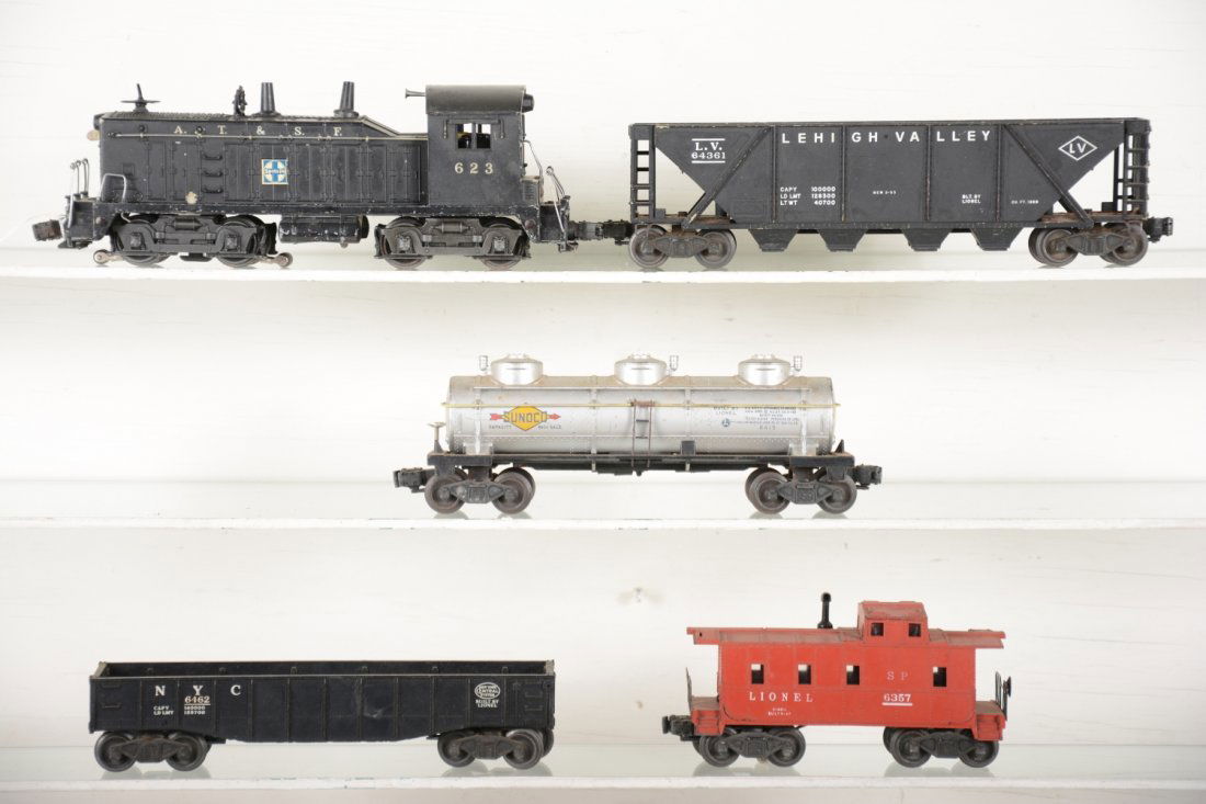Lionel 623 Diesel Freight Set: Includes a 623 SF NW-2 diesel, nice decals and good pulling loco; 6462 gondola; 6415 tank car; 6436 quadhopper; 6357 caboose with added stack. All show moderate playwear, C5+-6