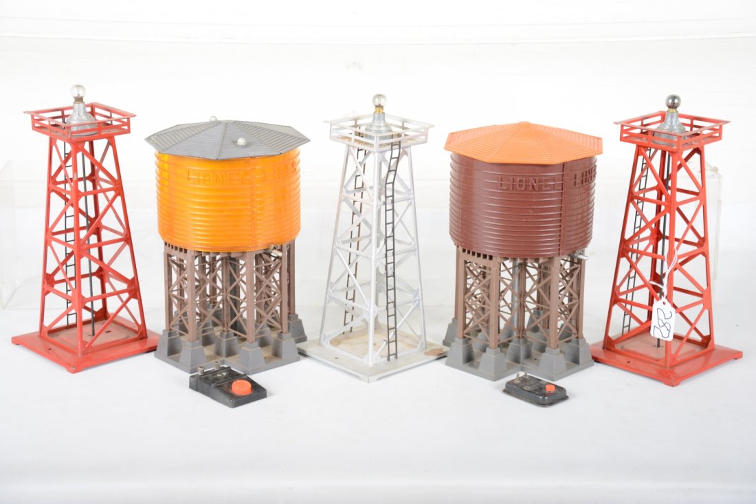 Lionel Accessory Lot: Includes a 138 & 30 water tanks with controls, missing spouts; 3 #394 beacons, all missing tops. These only show light playwear, well worth repairing.
