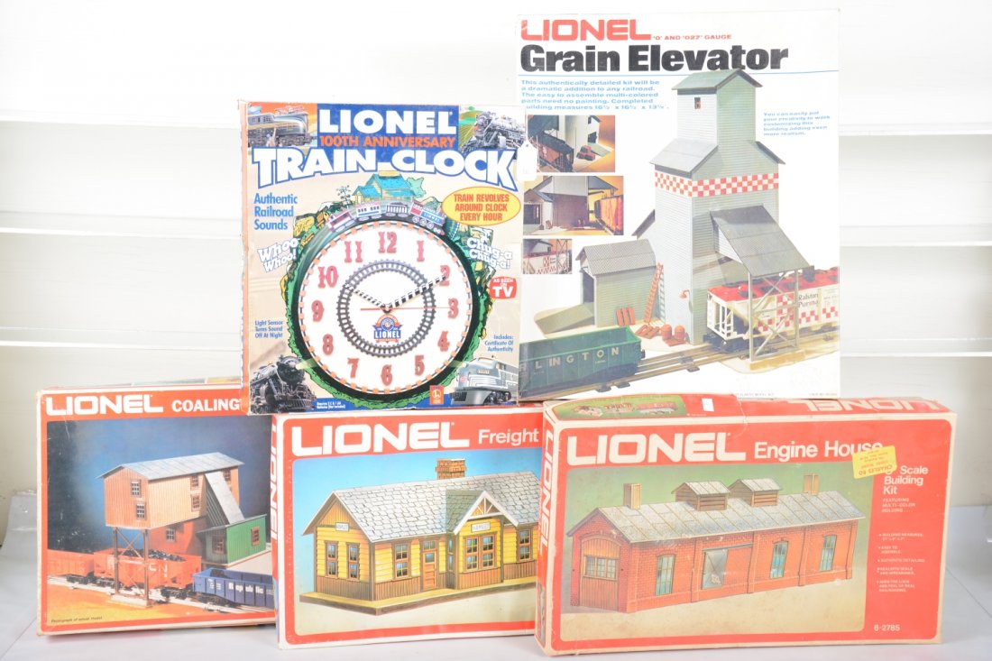Lionel Accessories: Includes a 100th anniversary clock; 2785 engine house; 2787 freight station; 2788 coaling station; 2796 grain elevator. All appear new in boxes, C9