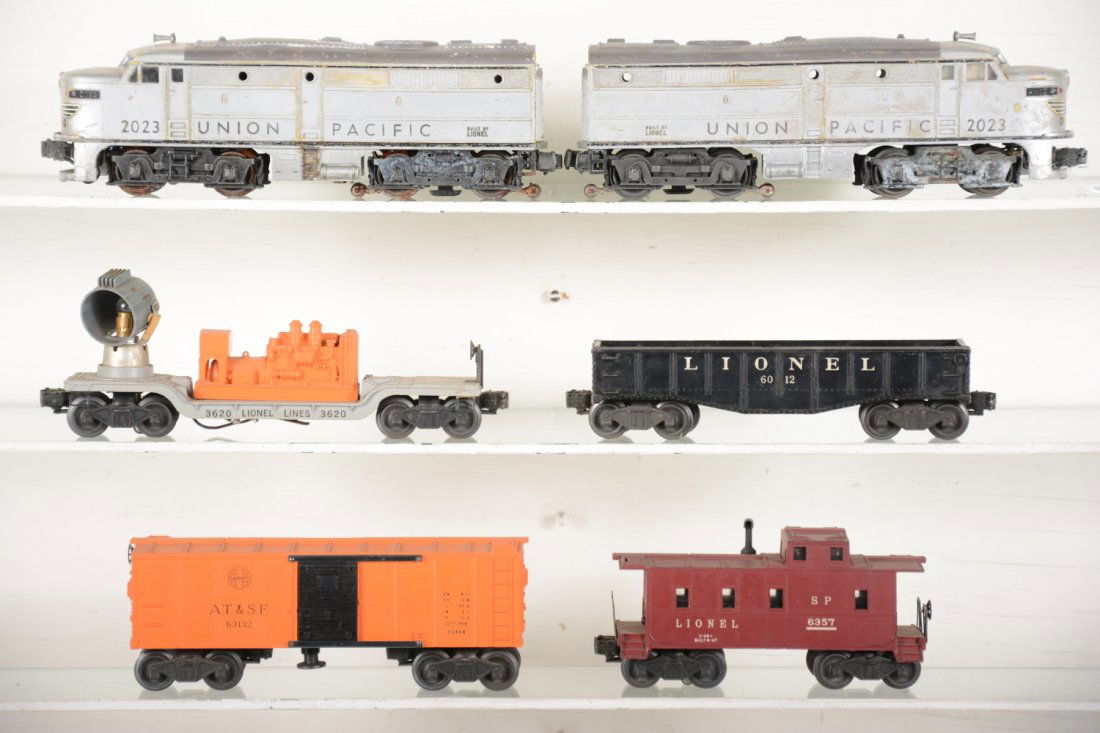 Lionel 2023 Diesel Freight Set: Includes a 2023 UP Alco AA Diesels, 1951 gray tops, some battery damage on bracket, very light on frame, no cover, may clean to C5+; 3620 searchlight car, no lens; 6012 gondola 3464 SF oper boxcar, no