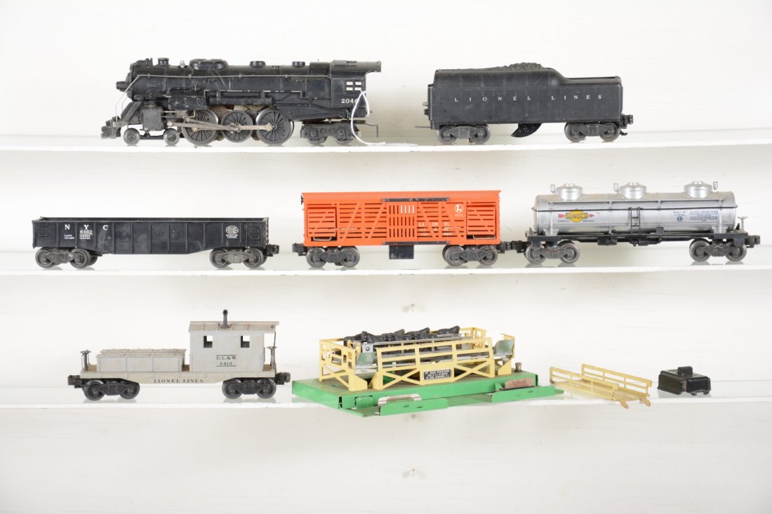 Lionel 2046 Steam Freight Set: Includes a 2046 Hudson loco, no jewels; 2046W tender, 1 broken step; 6462 gondola; 3656 cattle car with platform, 90% complete; 6515 tank car; 6419 work caboose. All show moderate playwear, rest C6 is
