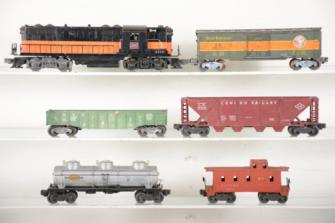 Lionel 2338 MR Diesel Freight Set: Includes a 2338 GP7 diesel, some battery damage on frame, 1 truck has some corrosion; 6462-25 gondola; 6464-450 GN boxcar; 6436 LV quadhopper; 6415 tank car; 2657 caboose, all have some issues as grad