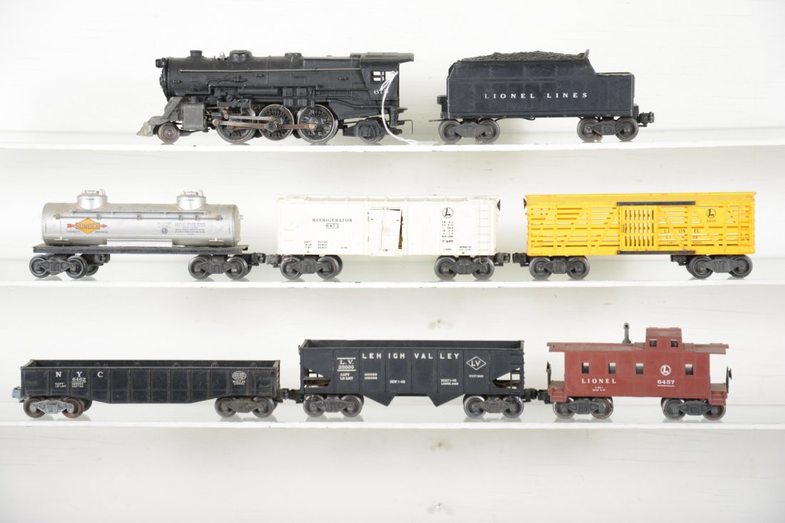 Lionel 675 Steam Freight Set: Includes a 675 O gauge steam loco, nicely over-painted around lettering; 6466WX tender; 6656 stock car; 6456 hopper; 6462 gondola; 6472 milk car; 6465 tank car; 6457 caboose. Rest show moderate playwe