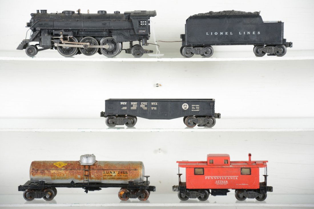 Partial Lionel Christmas Set: Includes a 224 loco, black handrails, C7; 2466W tender, C6+; 2452 gondola; 2755 Sunoco tank, 1 side rusted/stained; 2457 caboose, 1 coupler pick-up broken, all have early flying shoe trucks with shoul