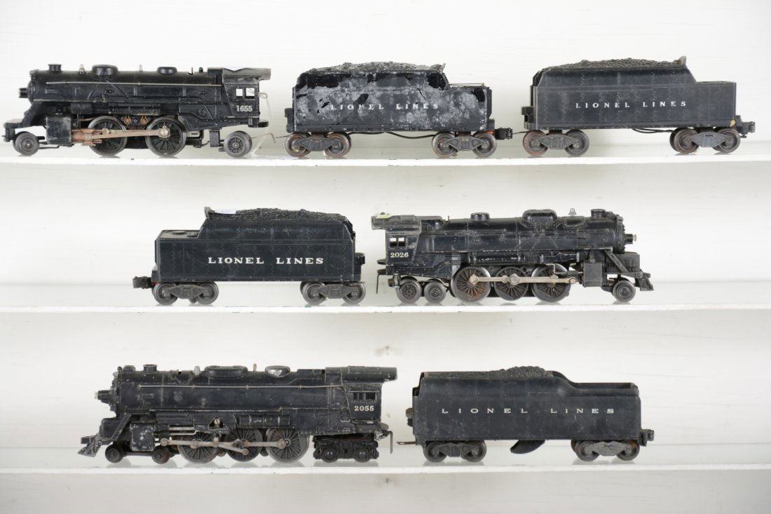 Lionel Loco & Tender Lot: Includes 2055 , bent front step; 2046W tender; 2026 loco; 6466W tender; 1655 loco; 6066T tender on 2466WX frame; mildewed 2466W tender. Grade range is C3-6 so examine photos closely.