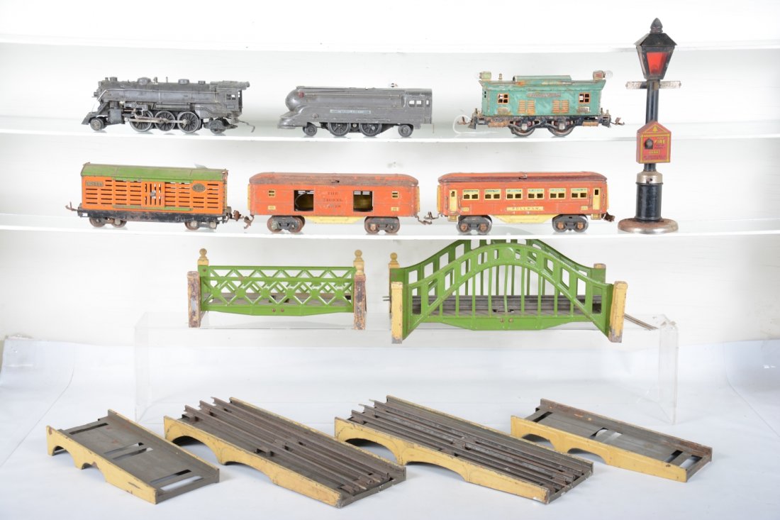 Pre War Lionel Lot, Plus: Most for restoration, includes 253 loco; 615 baggage; 613 coach; 813 stock car; 1666E gunmetal loco; 1688E gunmetal loco; 108 3pc bridge; 101 standard gauge 3-pc bridge; plus a Gong Bell street light,