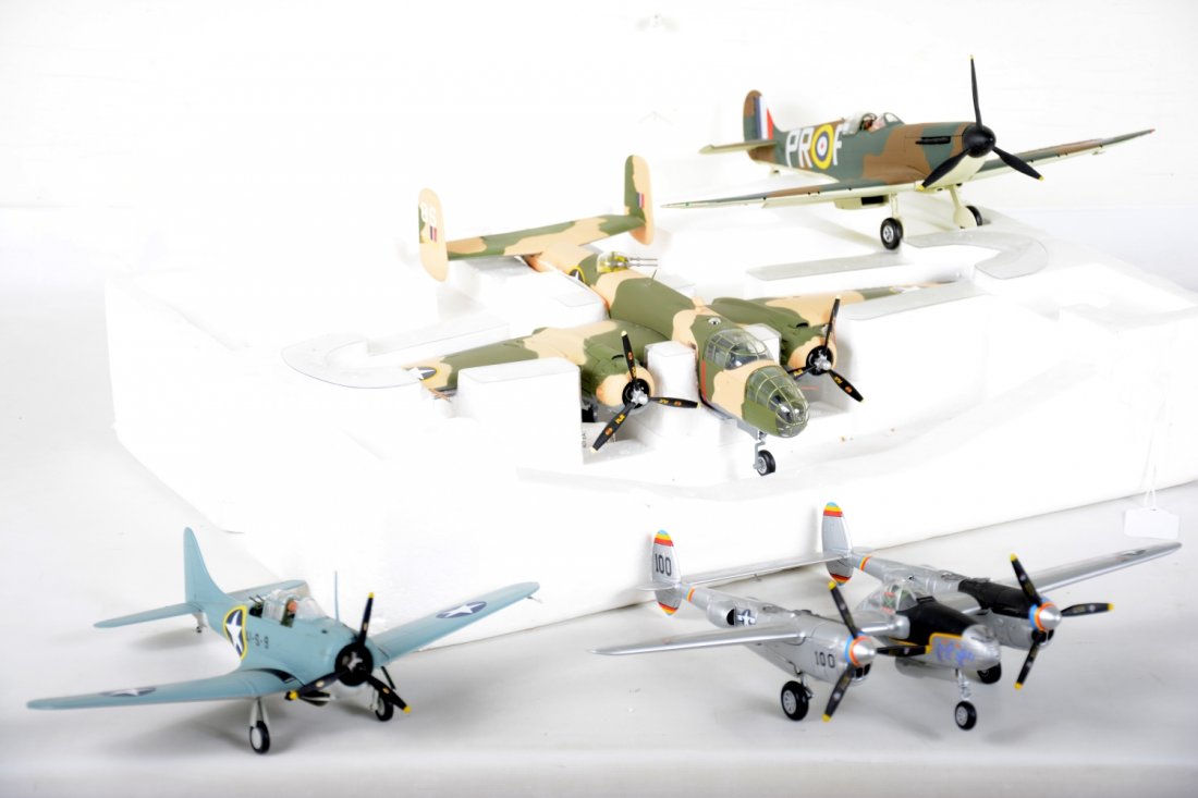 Nice Group CDC Cast Military Planes, Plus: High quality diecast scale airplanes including a 17" bomber with partial foam insert; Dauntless FMPM fighter, 10 1/2" WS; P-38, 13" WS; plus a Corgi Spitfire, 14" WS. All appear to be intact, but are 