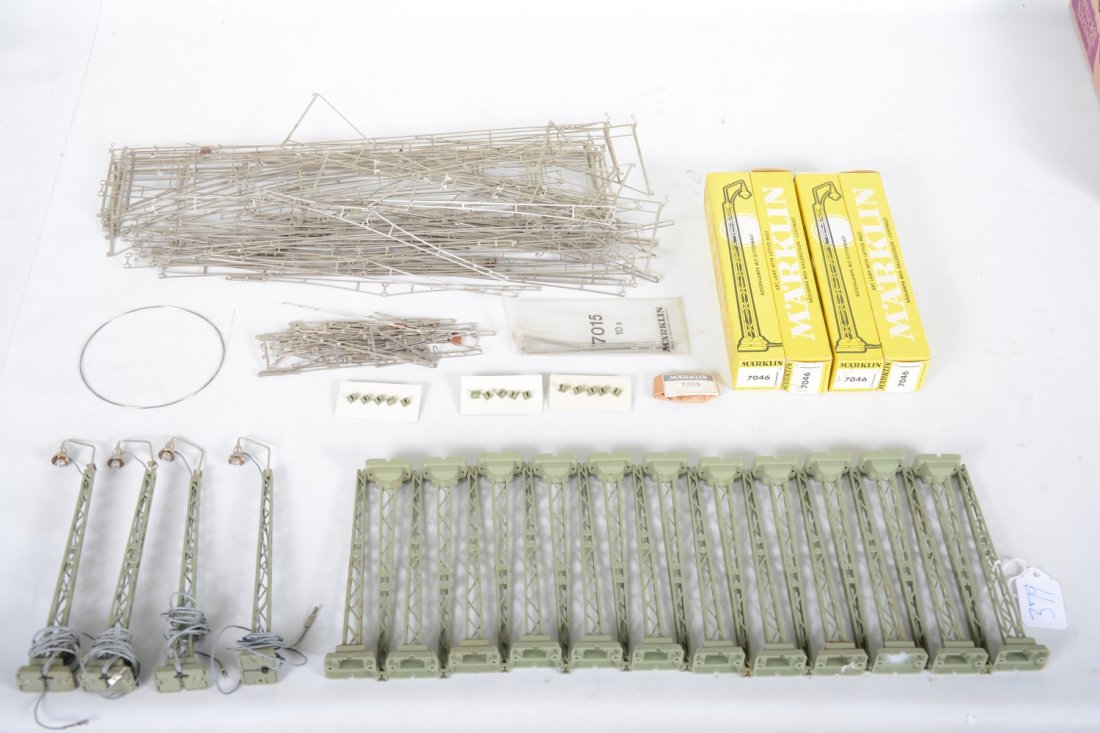 Marklin HO Cantenary, Plus: Includes 4 #7046 yard lights with boxes and a large selection of over-head cantenary wiring and stanchions, all like new.