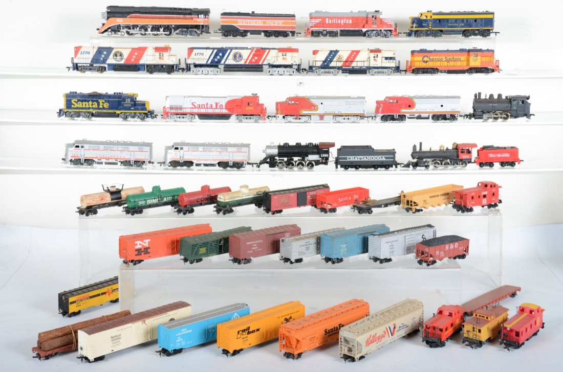 Large Group HO Trains: Includes 15 locomotives and several cars by Tyco, Bachmann, Revell & others. All show light to moderate playwear.
