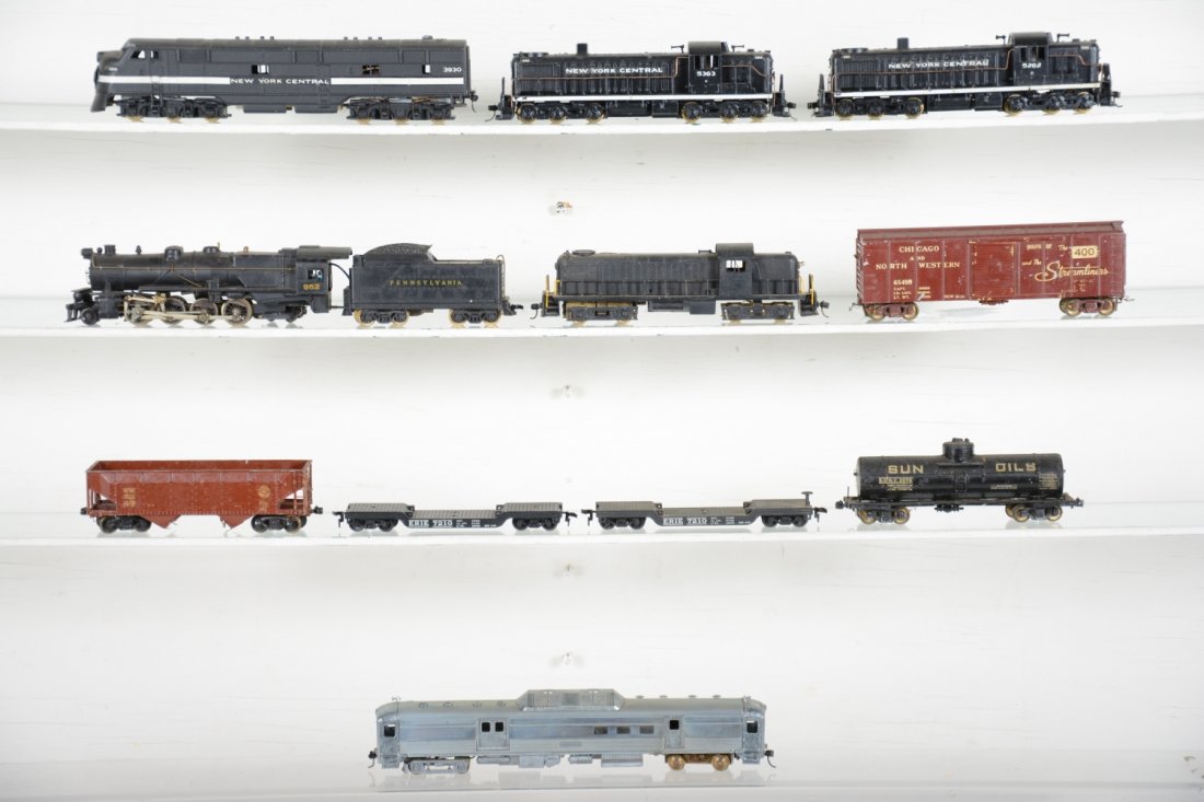 Early Diecast HO Trains Lot: Includes a cast & brass PRR 2-8-2 consolidation; NYC E8, 2 NYC RS3s, plus an unfinished diecast RS3; Budd car and 5 cast Freight cars. Alls how light to moderate playwear, heavy lot!