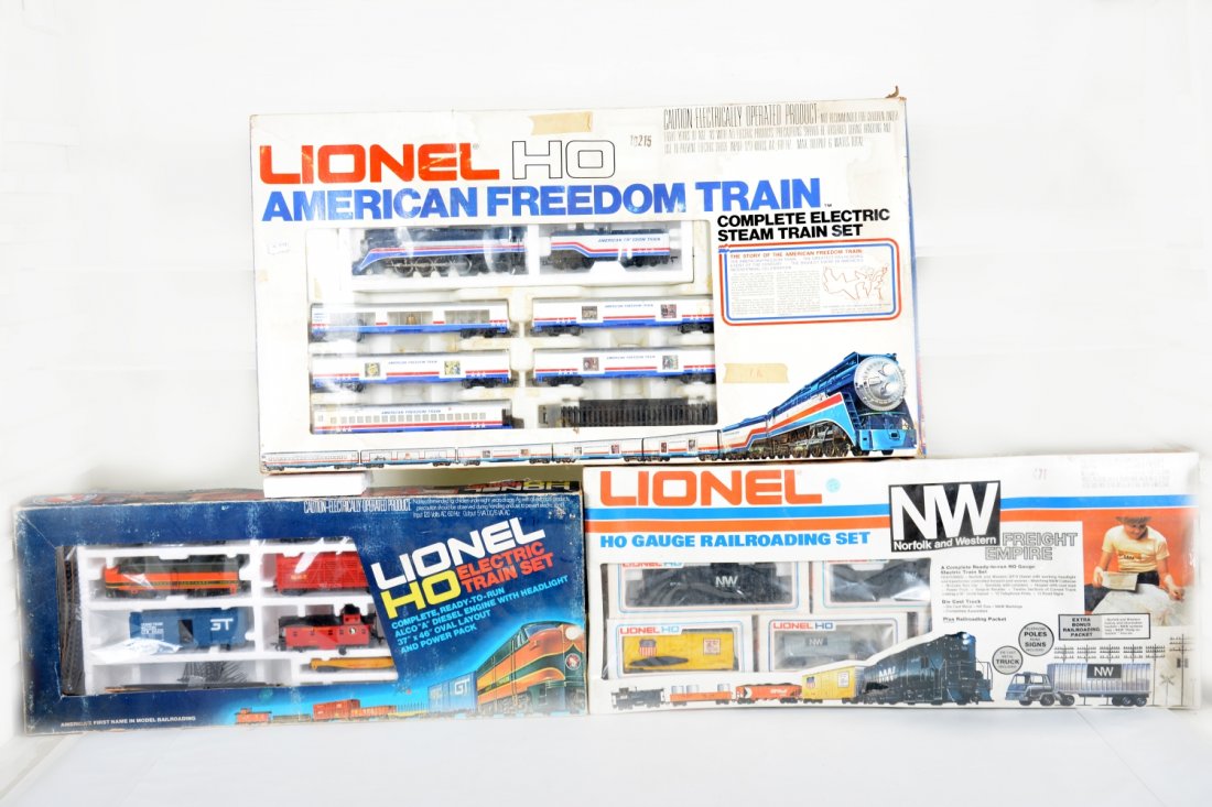 3 Boxed Lionel HO Sets: Includes the American Freedom Train set; 2789 N&W Freight Empire set, sealed; 1482 GN Freight. Rest show light wear with shop worn boxes. (large box needed for shipping)