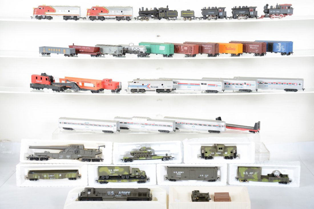 Large Group Assorted HO Trains: Includes a Bachmann 3-truck Shay, several dockside switchers, Cox military set with inserts, Tyco/Mantua Amtrak passenger set, Tyco/Mantua SF F7 AA Freight set and more. Most show light p[playwear, C7