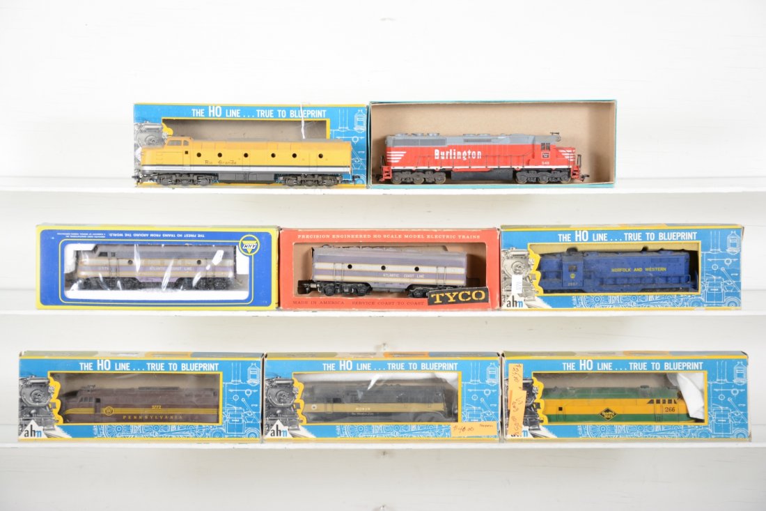 Assorted HO Diesels: Includes AHM RivaRossi Monon BL2; PRR Sharknose; N&W GP7; Tyco Mantua ACL F7 AB, 1 box incorrect; AHM Reading FM; Athearn SD-45; AHM Kraus Mafie UP diesel. All show light runtime with shelf dust and b