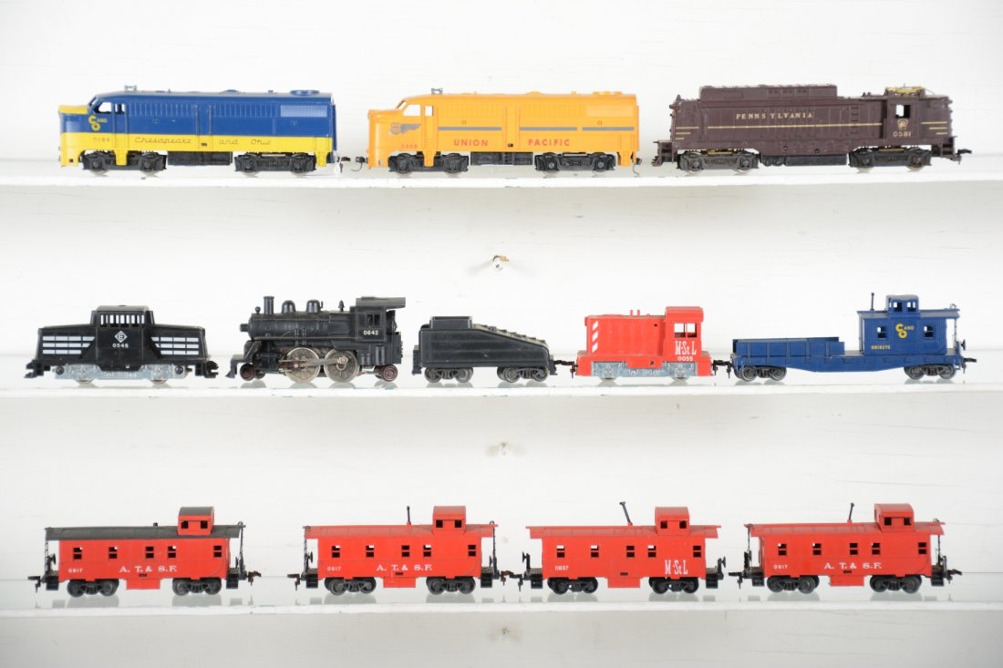 Lionel HO Trains Group: Includes an 0564 C&O Alco diesel, matching 0819-275 C&O work caboose; 0055 M&StL diesel with matching 0837 caboose; 0545 Erie 44-ton diesel; 0568 UP Alco on dummy frame; 0642 2-4-2 steam loco & tender