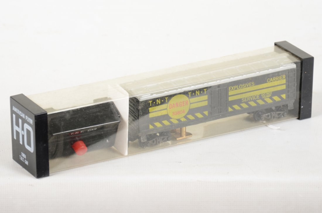 American Flyer 33804 TNT Car in Kleer-Pack: Nice like new piece complete with controller and instructions. It shows very light handling, C8+-9