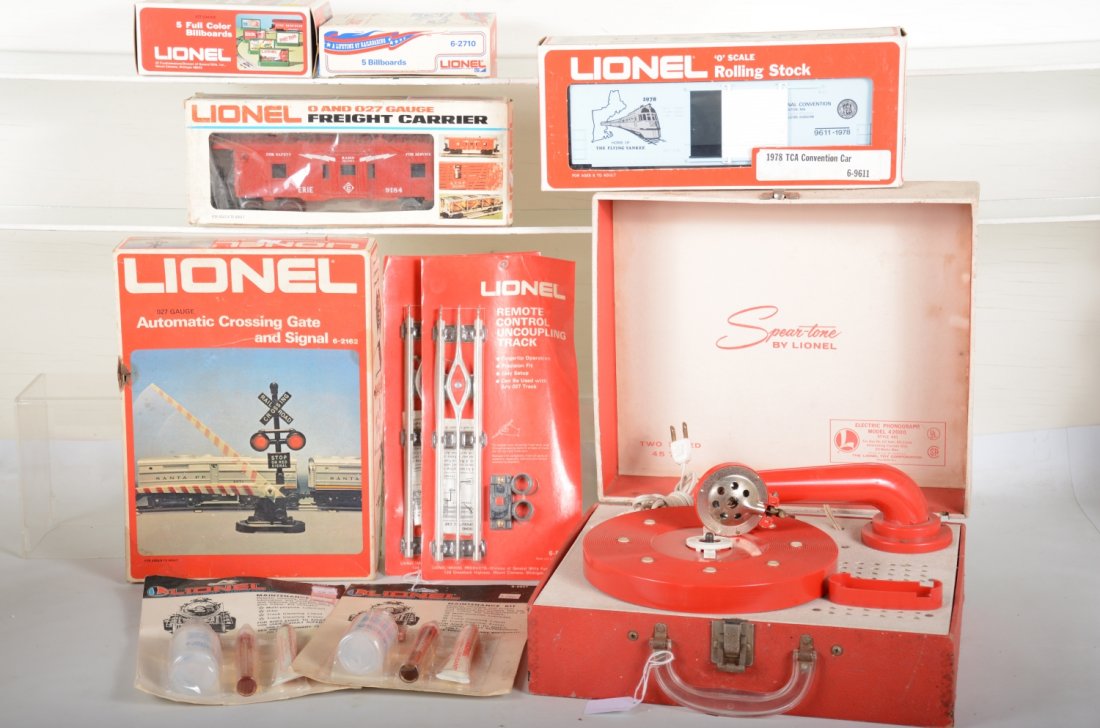 Lionel Accessories: Includes a 601 Lionel Spear-tone record player; 9184 Erie baywindow caboose; 9611 1978 TCA boxcar; 2 #2927 maintenance kits sealed on cards; 2162 highway crossing gate; 2 variations #2710 billboards; 