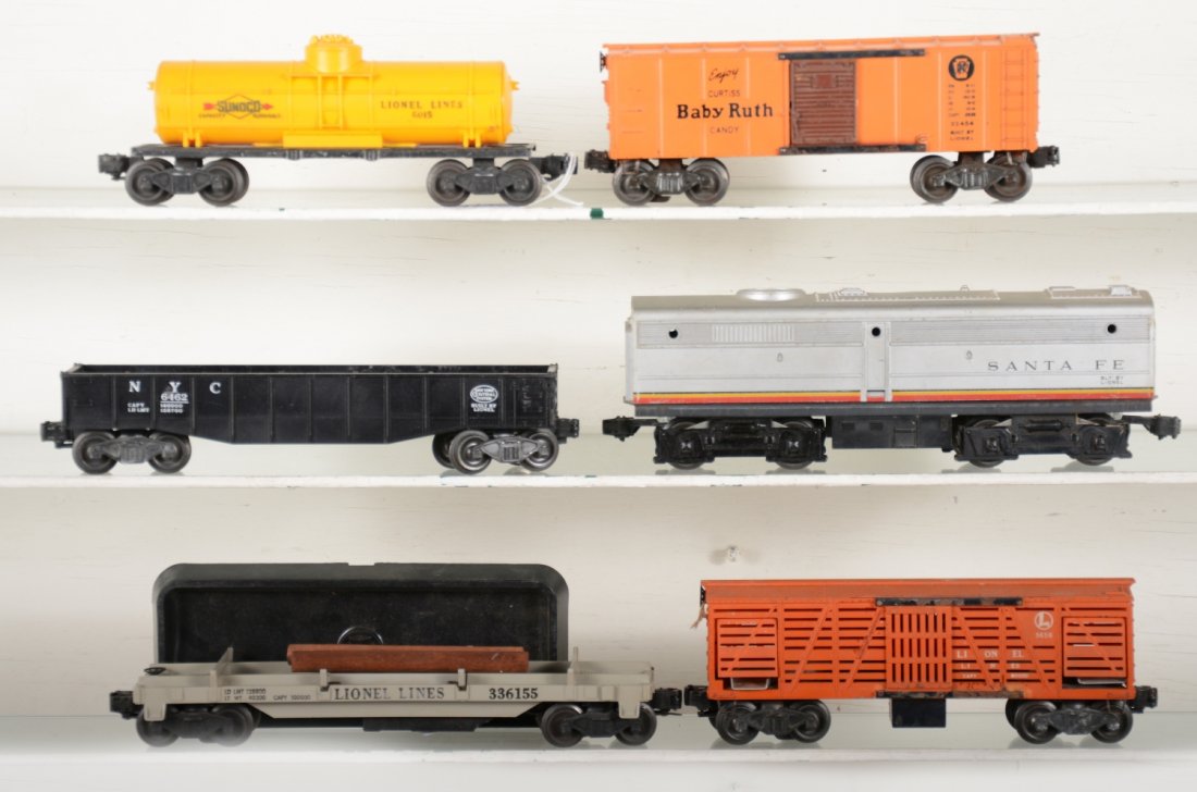 Lionel Rolling Stock: Includes a Lionel 218C SF Alco B-unit; 6462 gondola; 3656 operating cattle car only; 3361-55 log dump with bin; 2454 BR boxcar; 6015 Sunoco tank. All show light to moderate playwear, C6-7