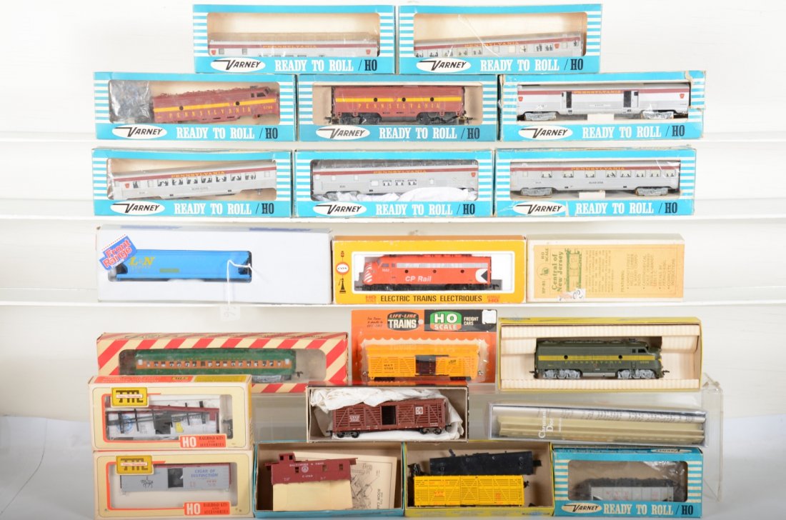 Boxed HO Locos & Rolling Stock: Assorted makers like Varney, Cox, Athearn, Penn Line & Others with several diesels, freight & passenger cars. The Varney PRR passenger cars have some missing and loose trucks, otherwise all show light