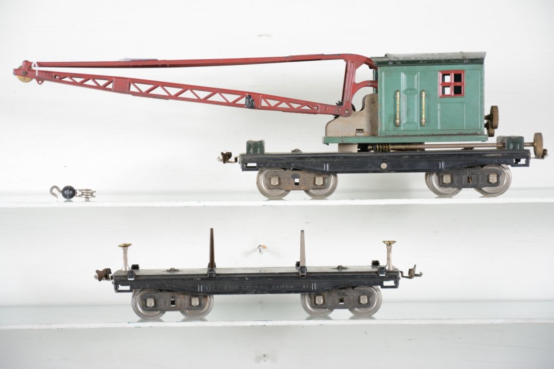 Lionel 219 & 211 Freight Cars: Standard Gauge. Includes a 219 crane, missing line with hook, working; 211 lumber car, missing most stakes & load. They show moderate playwear, C6-