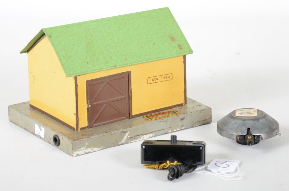 Scarce American Flyer 595 a-Koostikin Talking Tool Shed: Unusual pre war accessory. It is complete with record & speaker, but includes an additional postwar speaker as-well. It shows moderate playwear, C5+-6, Scarce !