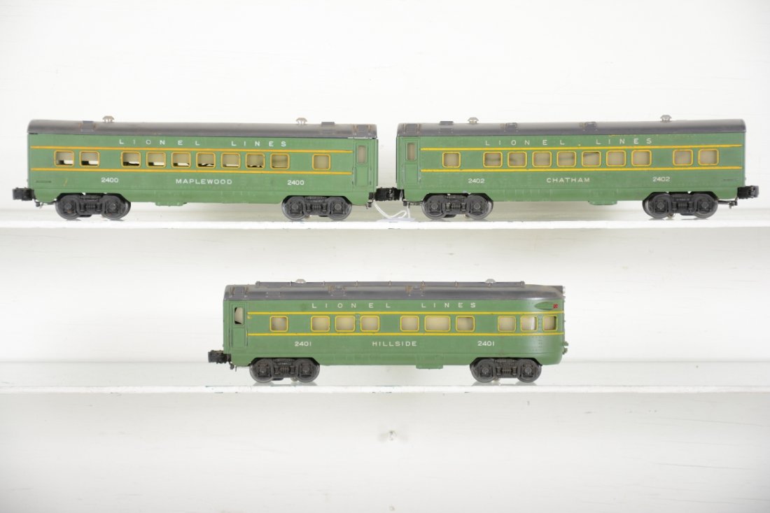Clean Lionel 2400 Series Passenger Cars: Includes 2400 Maplewood Pullman; 2402 Chatham Pullman; 2401 Hillside observation. They have matching graphics and show light to moderate playwear, C7